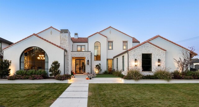 6714 Lupton Dr, Dallas, TX 75225 - mediterranean / spanish-style home featuring a yard