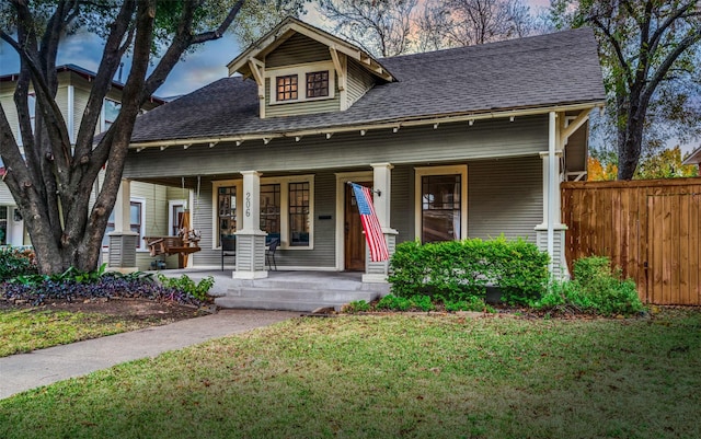 craftsman house featuring a porch and a front yard