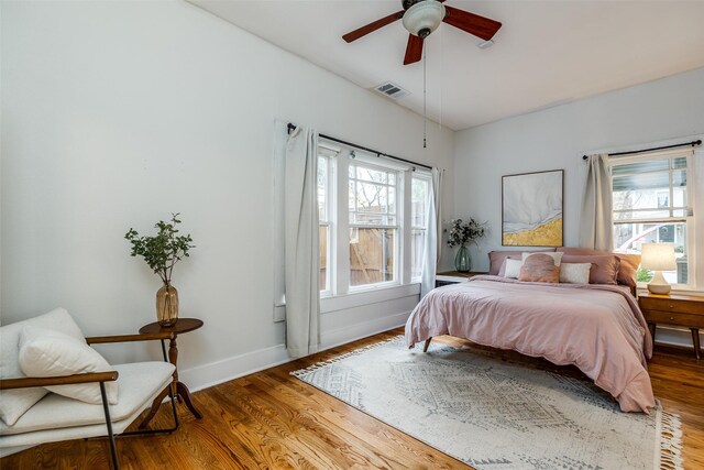 bedroom with ceiling fan and wood-type flooring