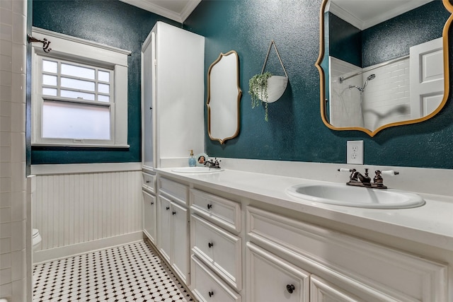 bathroom featuring ornamental molding, walk in shower, vanity, and toilet