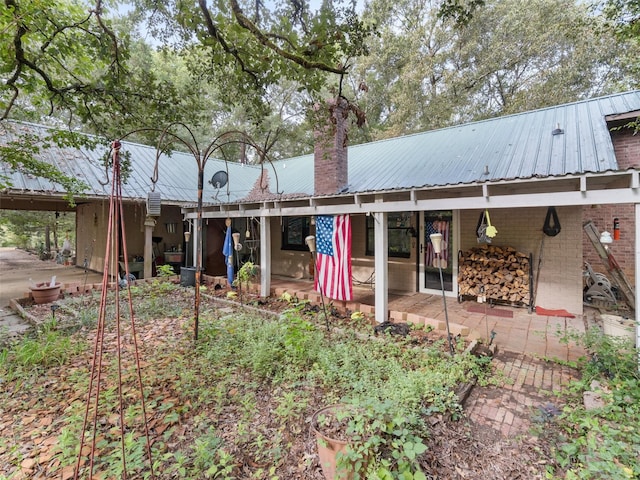 back of property featuring a patio