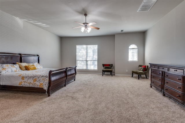 bedroom featuring ceiling fan and light carpet