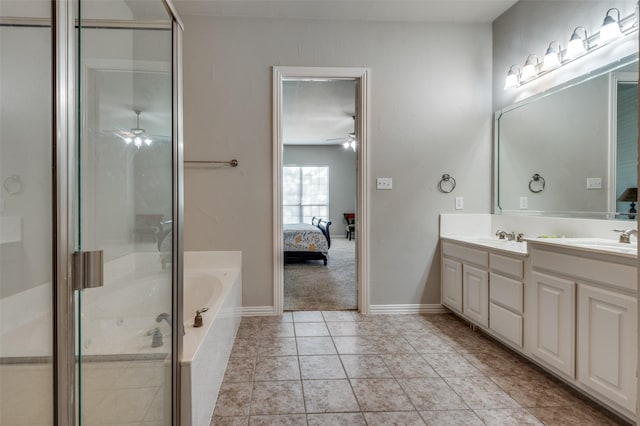 bathroom featuring tile patterned flooring, shower with separate bathtub, vanity, and ceiling fan