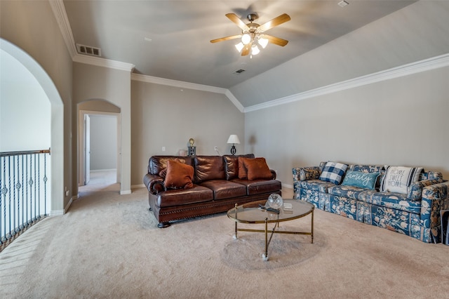 carpeted living room featuring ceiling fan, ornamental molding, and vaulted ceiling