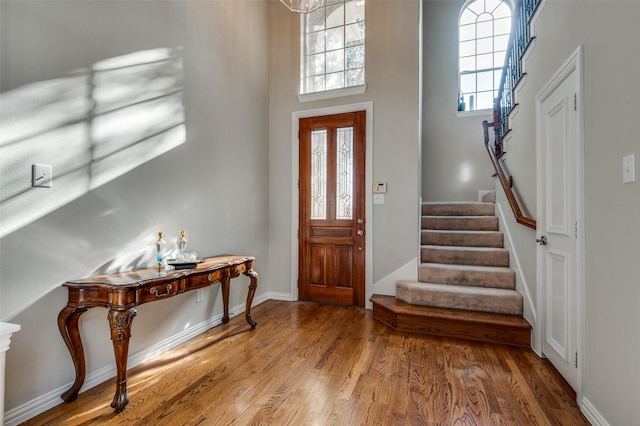 entryway with hardwood / wood-style flooring