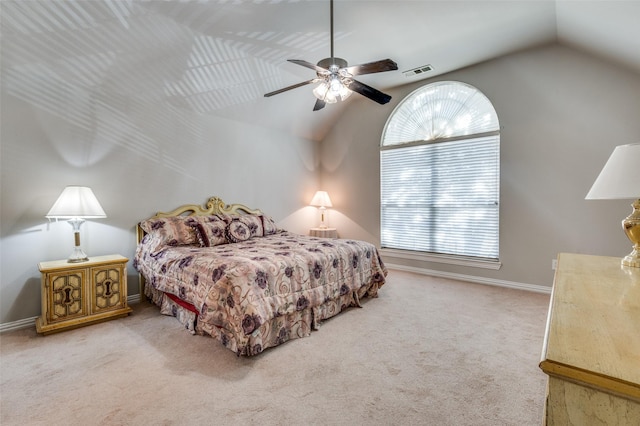 carpeted bedroom with ceiling fan and lofted ceiling