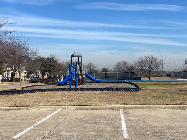 view of jungle gym with a lawn