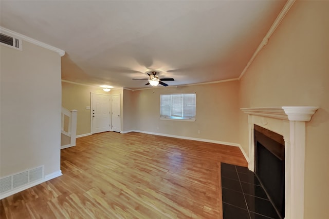 unfurnished living room featuring ornamental molding, wood-type flooring, and ceiling fan