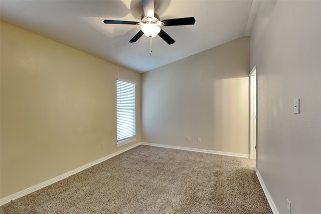 unfurnished room featuring ceiling fan, lofted ceiling, and carpet flooring