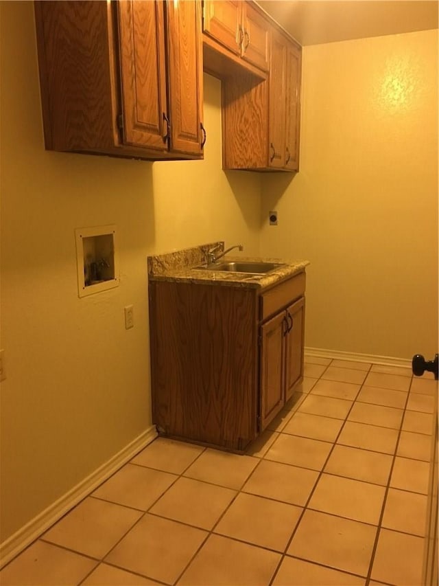 kitchen with light tile patterned flooring and sink