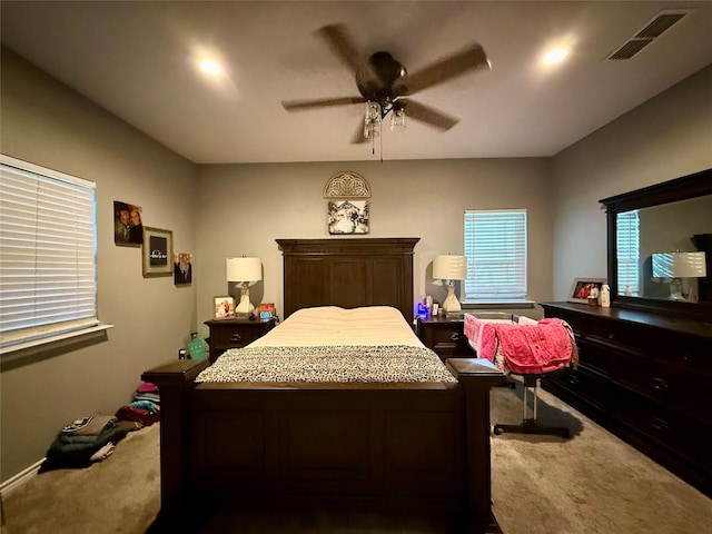 bedroom with ceiling fan and carpet flooring