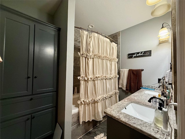 248 Mill, Emory, TX 75440 - bathroom featuring marble finish floor, a sink, shower / bath combo with shower curtain, and double vanity