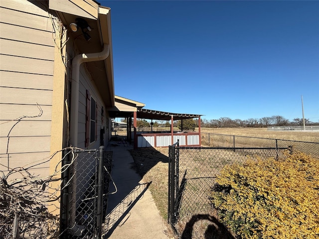 view of yard with a rural view