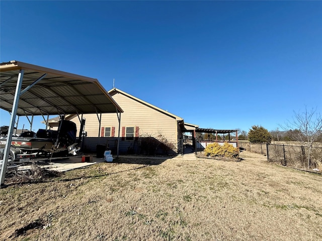 248 Mill, Emory, TX 75440 - view of home's exterior featuring a lawn, a carport, and fence