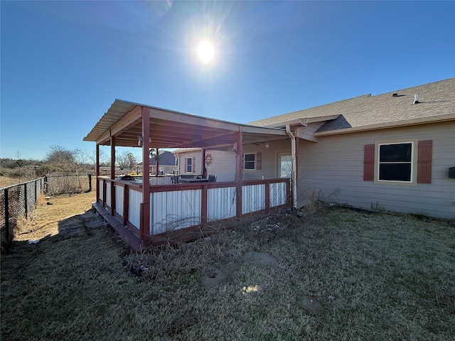 248 Mill, Emory, TX 75440 - back of house with a lawn, fence, and roof with shingles