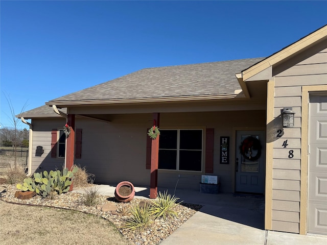 248 Mill, Emory, TX 75440 - property entrance with roof with shingles and fence
