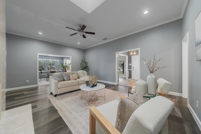 living area with recessed lighting, wood finished floors, baseboards, and ornamental molding