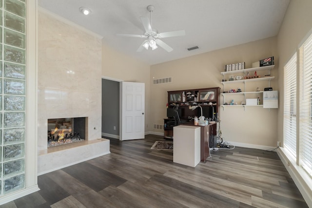 home office with visible vents, dark wood-style floors, and a high end fireplace