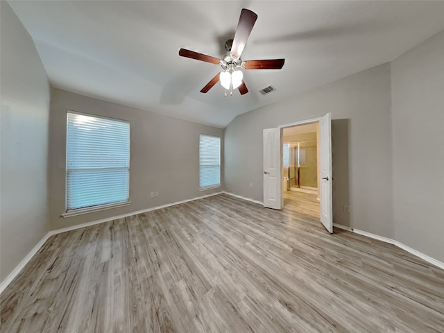 unfurnished bedroom featuring light hardwood / wood-style flooring, ceiling fan, and vaulted ceiling