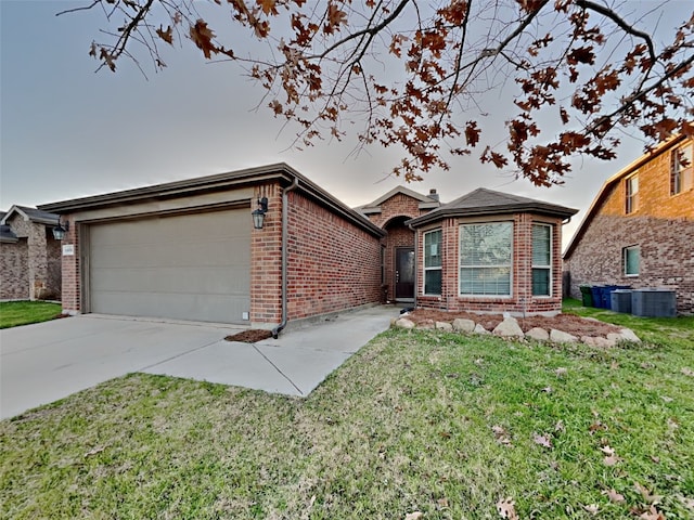 single story home with a garage and a front yard