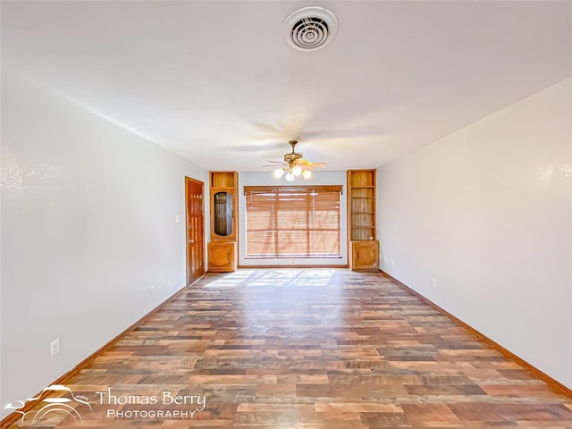 unfurnished living room featuring hardwood / wood-style flooring and ceiling fan