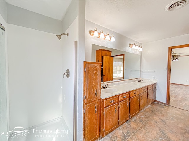 bathroom featuring vanity and walk in shower