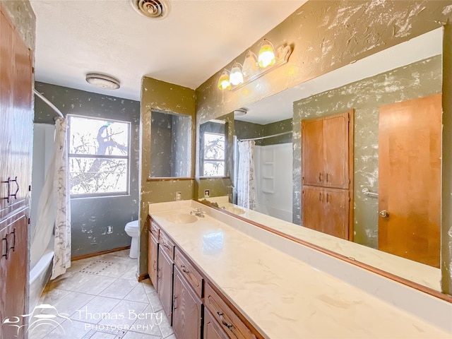 full bathroom featuring shower / bath combination with curtain, vanity, toilet, and tile patterned flooring