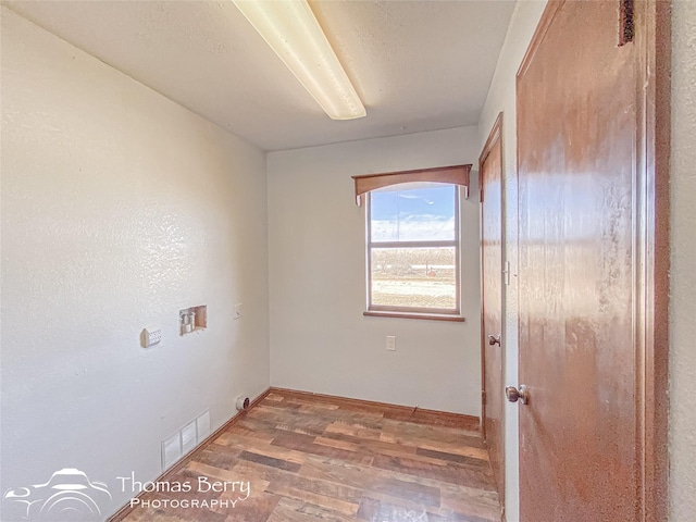 spare room with wood-type flooring