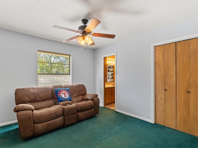 carpeted living room featuring ceiling fan