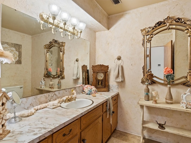 bathroom featuring ornamental molding, tile patterned flooring, and vanity