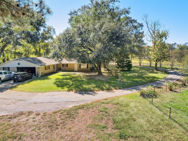 view of front facade with a garage and a front lawn