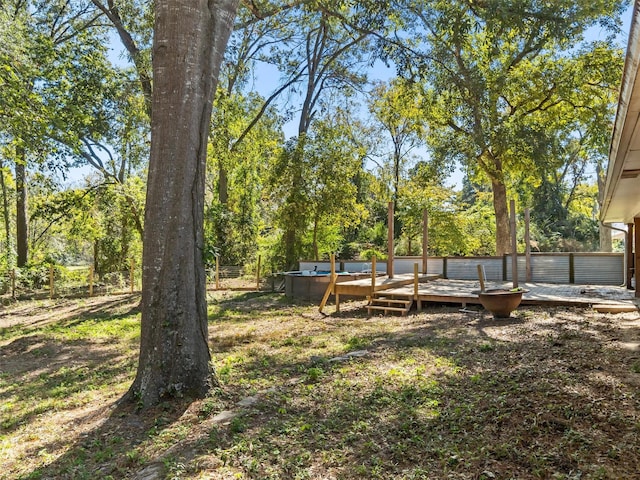 view of yard with a pool side deck