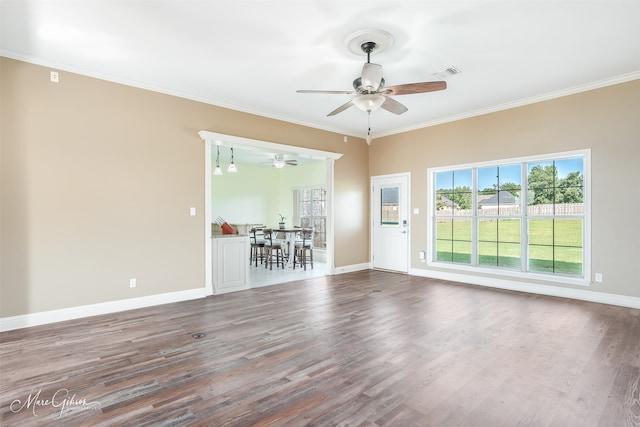 empty room featuring crown molding, ceiling fan, and hardwood / wood-style flooring