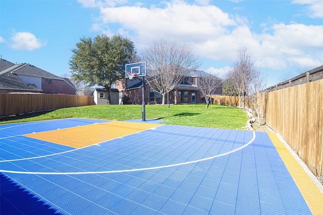 view of basketball court featuring a lawn