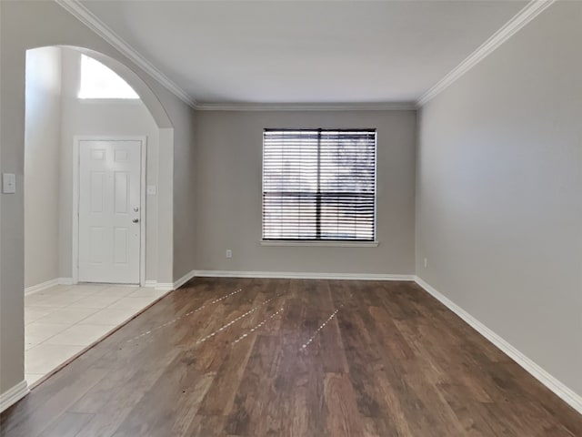 foyer featuring hardwood / wood-style flooring and ornamental molding