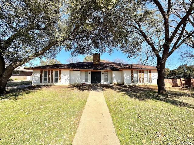 ranch-style home with a front yard