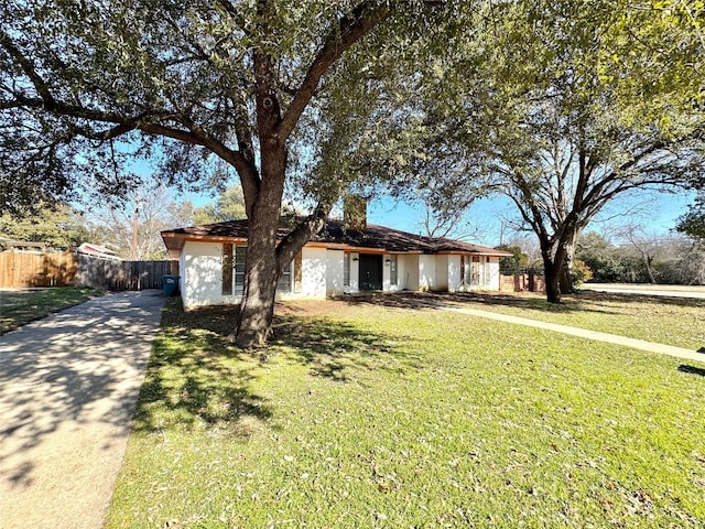 ranch-style house with a front lawn