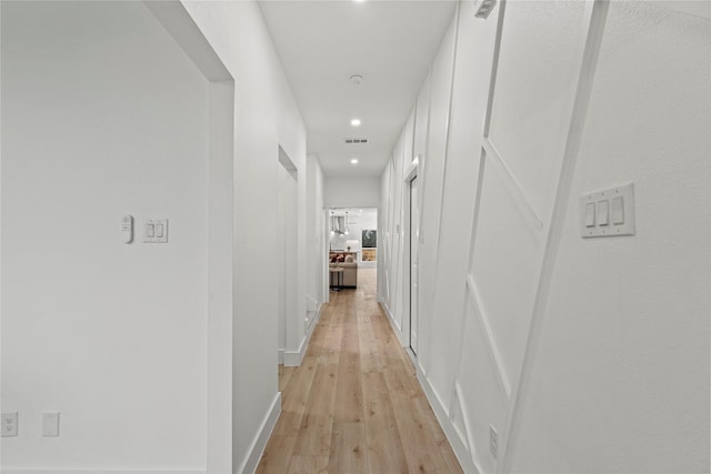 corridor featuring light wood-type flooring