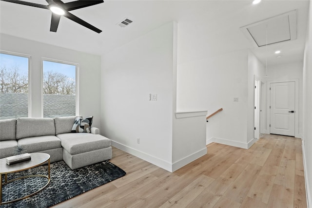 living room featuring ceiling fan and light wood-type flooring