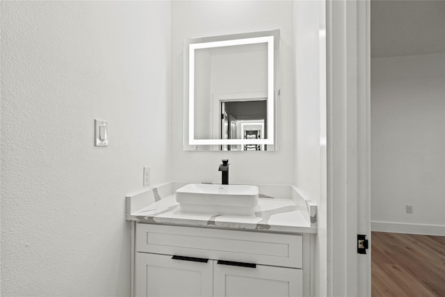 bathroom featuring vanity and wood-type flooring