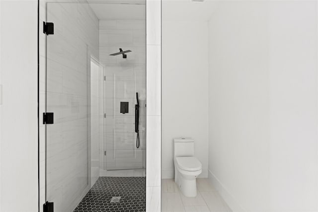 bathroom with tile patterned floors, a shower with door, and toilet