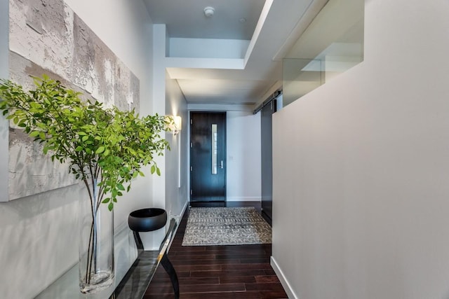 corridor featuring dark hardwood / wood-style floors