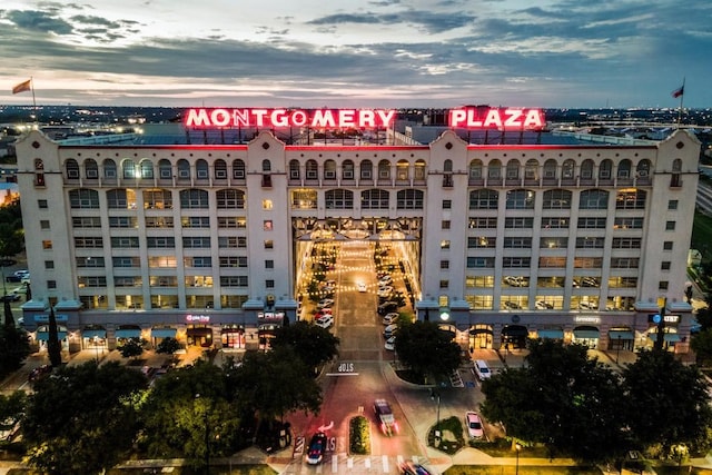 view of outdoor building at dusk