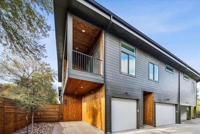 view of side of home featuring a garage