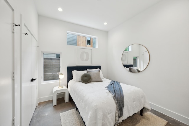 2138 Lovedale Ave Unit 105, Dallas, TX 75235 - bedroom featuring recessed lighting, baseboards, and finished concrete flooring