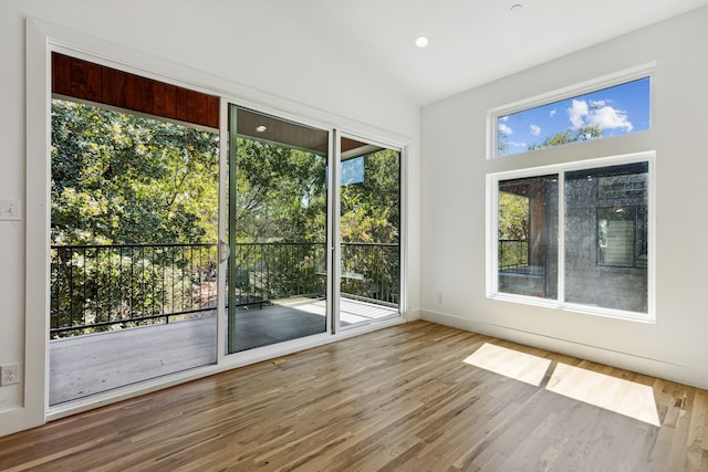 unfurnished sunroom with vaulted ceiling