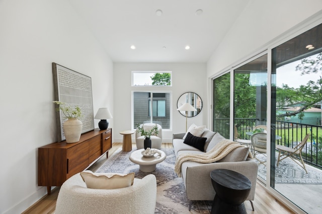 2138 Lovedale Ave Unit 105, Dallas, TX 75235 - living room featuring baseboards, recessed lighting, and light wood-type flooring