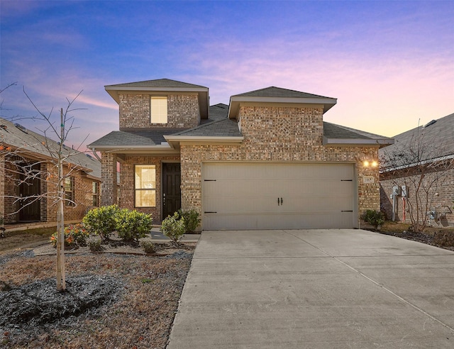 view of front of property featuring a garage