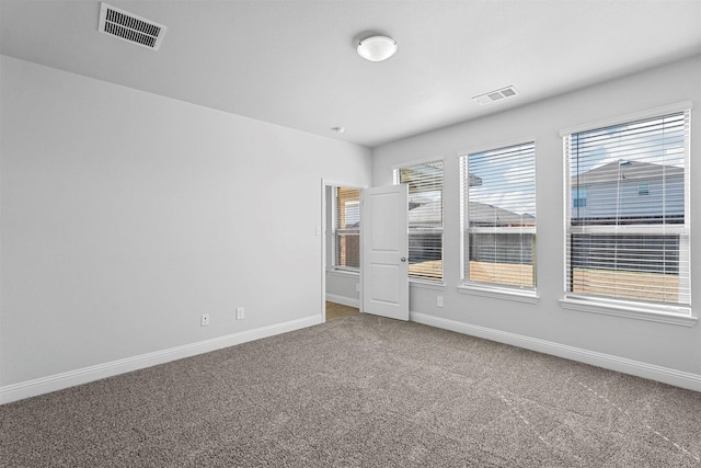 spare room featuring carpet flooring