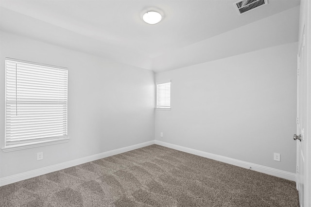 spare room featuring carpet floors